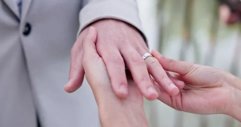 Couple, holding hands and ring for marriage, wedding or ceremony for commitment Video stock 250970623