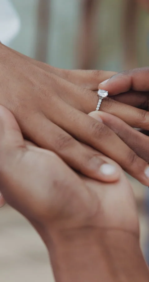 Couple, holding hands and ring for wedding, commitment or marriage union or 動画素材 251129460