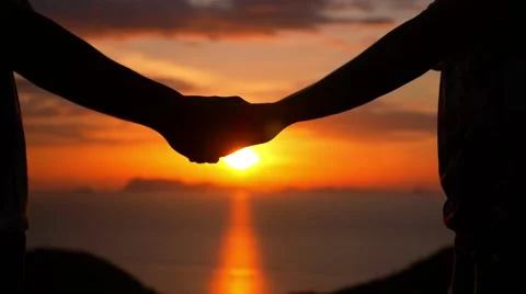Couple Holding Hands during Sunset. Slow Motion. Stock Footage 41880743