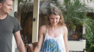 Couple holding hands of each other and walking in the tropical park. Young Man Stock Footage 86009529