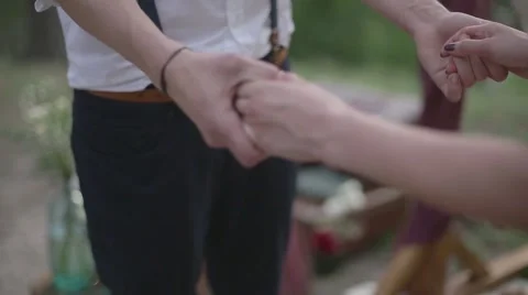 Couple holding hands in a forest Stock Footage 61248379