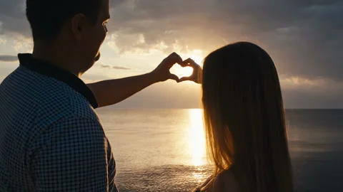 Couple holding hands in a heart shape 動画素材 101573409