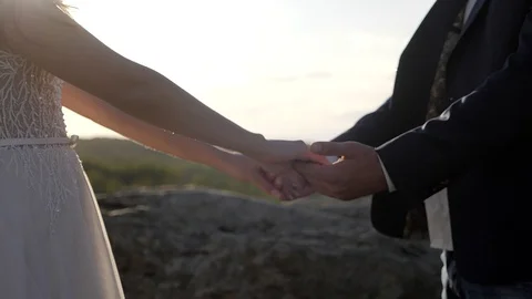 Couple holding hands in the mountains Stock Footage 129072971
