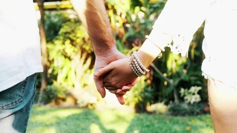 Couple holding hands in park. Stock Footage 101894194