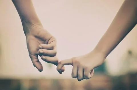 Couple holding hands Stock Photos