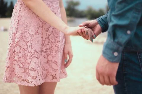 Couple holding hands Stock Photos