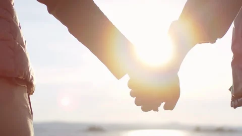 Couple Holding Hands on Romantic Date at Sunset Stock Footage 112884796