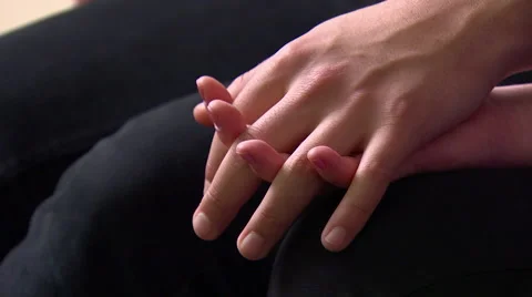 Couple holding Hands Sitting Next to Each Other Stock Footage 48712296