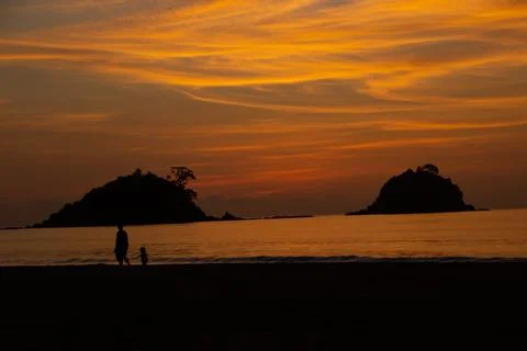 Couple holding hands at sunset Stock Photos