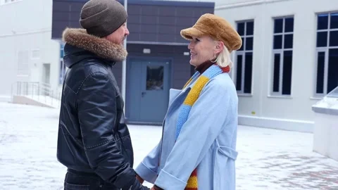 Couple holding hands is talking during winter Video stock 303876800