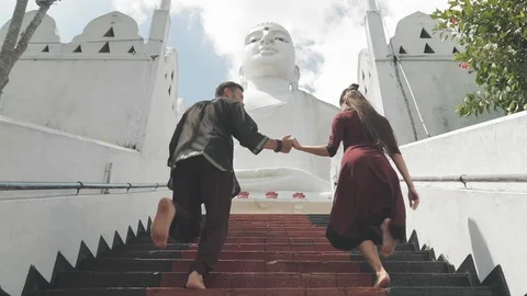 Couple holding hands while climbing stairs Vídeo Stock 108633117