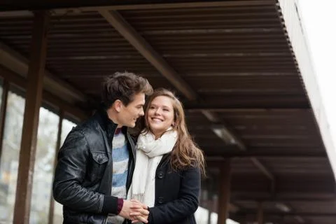 Couple Holding Hands While Standing Under Awning Fotos Stock