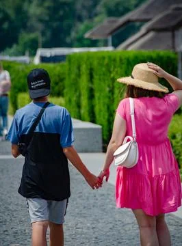 Couple Holding Hands While Walking Stock Photos