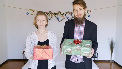 Couple holding presents in authentic room. Stock Footage 102655915