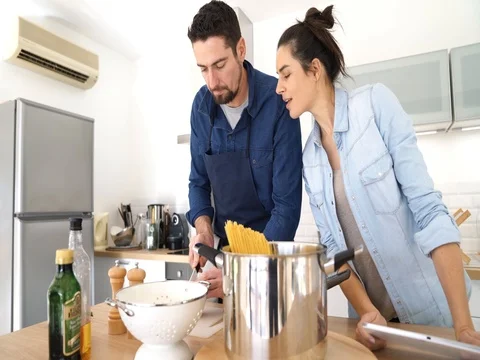 	Couple at home having fun cooking together Stock-Footage 84003986