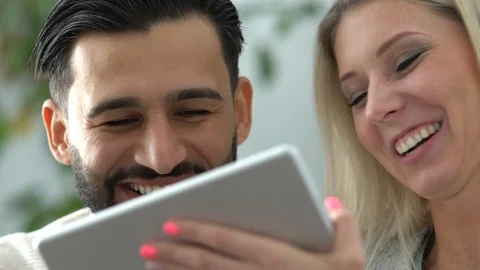 Couple at home using a tablet Stock Footage 101073456