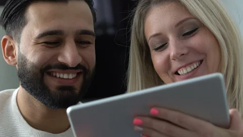 Couple at home using a tablet Stock Footage 101074375