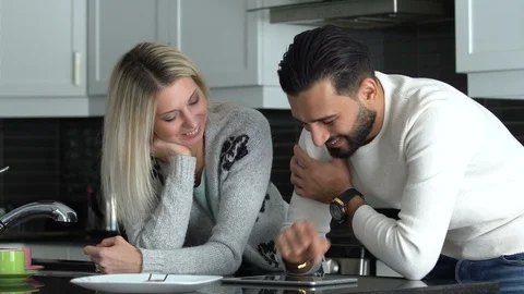 Couple at home using a tablet Stock Footage 101075334