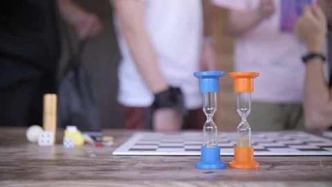 A couple of hourglasses are on the table Stock Footage 160197381