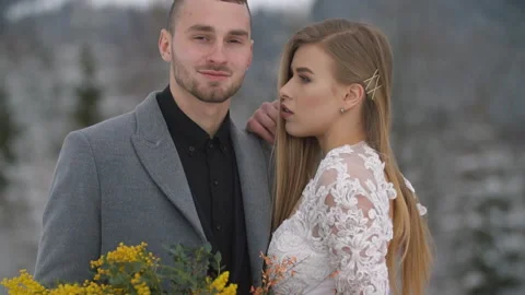 Couple hugging on the background of the winter forest Stock Footage 141531747