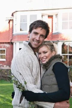 Couple hugging in backyard Stock Photos