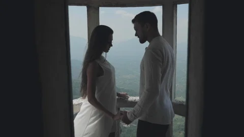 Couple hugging on balcony Stock Footage 108632973