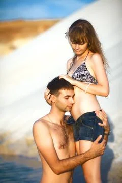 Couple hugging on beach Stock Photos