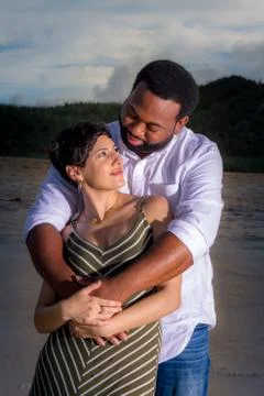 Couple hugging on the beach Stock Photos