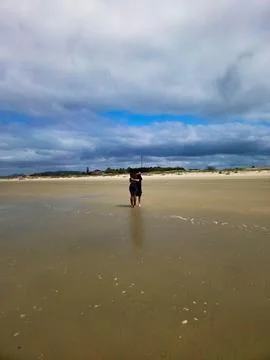 Couple hugging on the beach Stock Photos