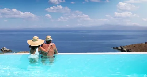 A couple hugging at the edge of an infinity pool Video stock 276887555