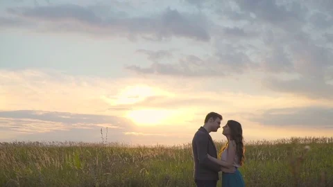 Couple hugging in a field Stock Footage 72635291