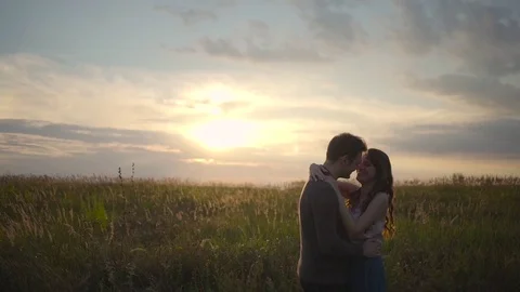 Couple hugging in a field Stock Footage 72635307