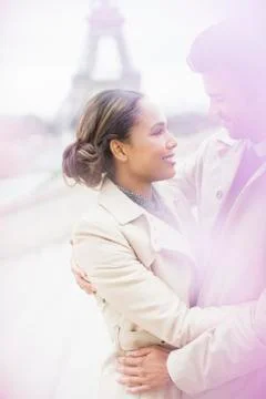 Couple hugging in front of Eiffel Tower, Paris, France Stock Photos