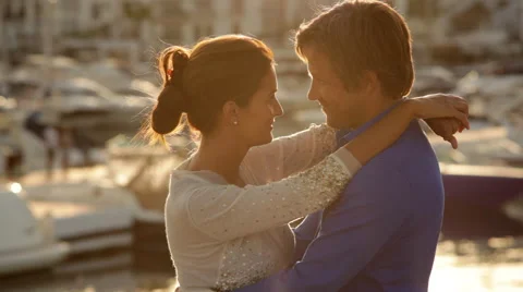 Couple Hugging by Marina in evening light Stock Footage 43618445