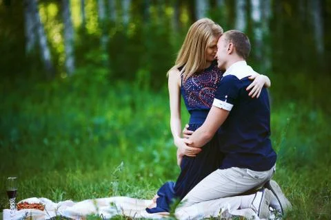 Couple hugging in meadow Stock Photos