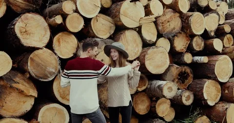 Couple hugging near stack of logs Stock Footage 96227864