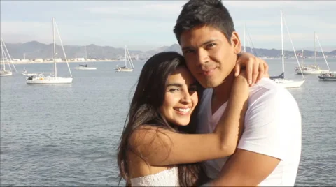 Couple hugging by the ocean Stock Footage 1093286