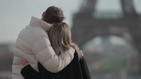 Couple Hugging in Paris with Eiffel Tower in Background Romantic Embrace in Stock Footage 328567291