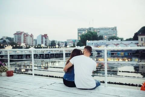 Couple hugging on pier Stock Photos