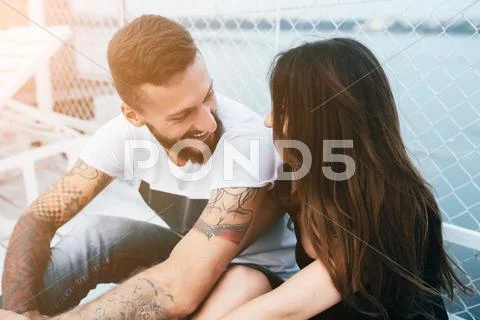 Couple hugging on pier Stock Photos