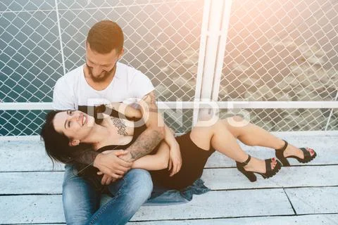 Couple hugging on pier Stock Photos