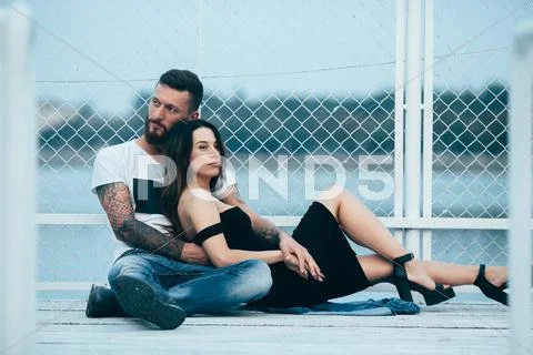 Couple hugging on pier Stock Photos