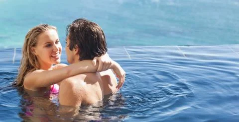 Couple hugging in the pool Stock Photos