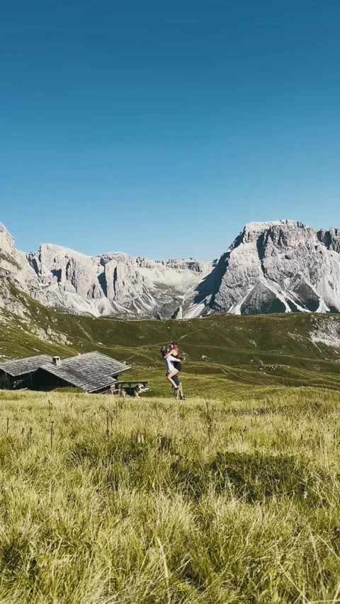 Couple Hugging on Seceda with Dog Stock Footage 329584594