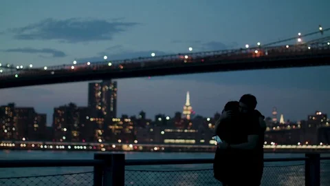 Couple is hugging under the Brooklyn bridge Stock-Footage 79849546