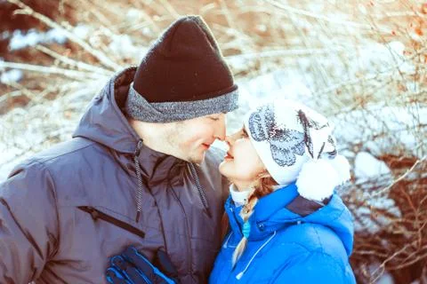 Couple hugging in winter Stock Photos