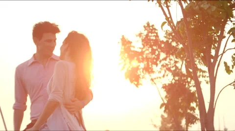 A couple hugs at sunset Stock Footage 63078804