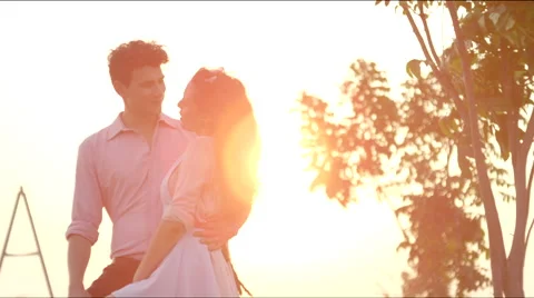 A couple hugs at sunset Stock Footage 63080245