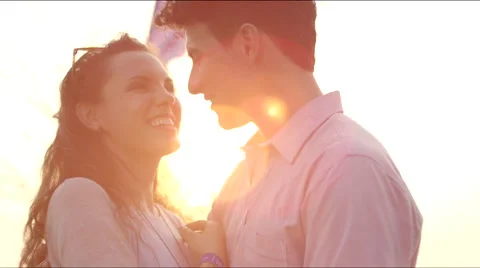 A couple hugs at sunset Stock Footage 63083725