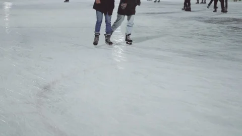 A couple is ice skating in the winter. Video stock 126724476